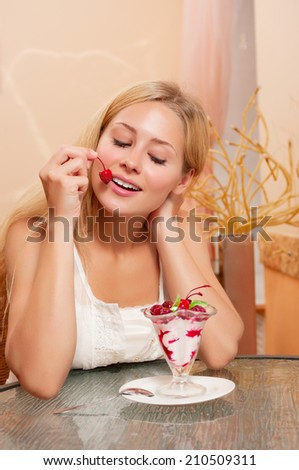 Young girl eat dessert in cafe