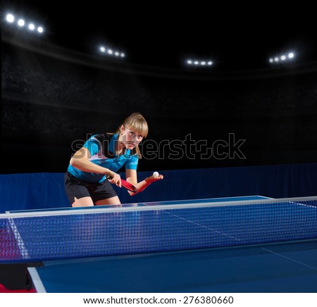 Young girl table tennis player at sports hall