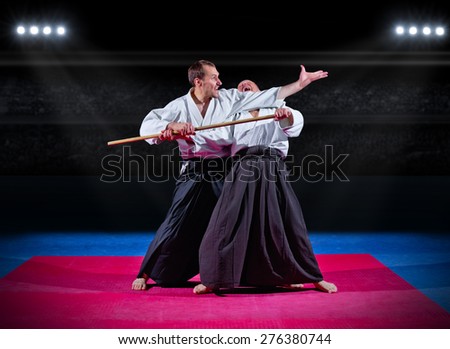 Two martial arts fighters at sports hall