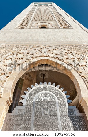 The entrance gate to the highest minaret in the world. Islamic decorative patterns on the walls of frescoes in the Arab shapes. Hassan II Mosque is located in Casablanca, Morocco.