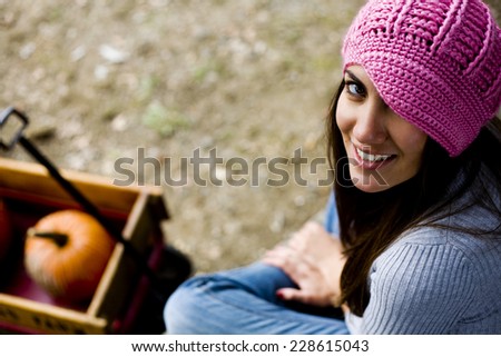 cute woman pumpkin picking