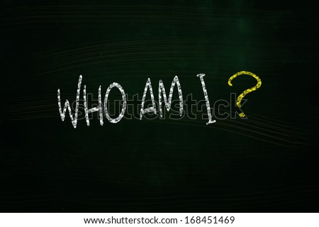 Who am I Lettering, written with Chalk on Blackboard