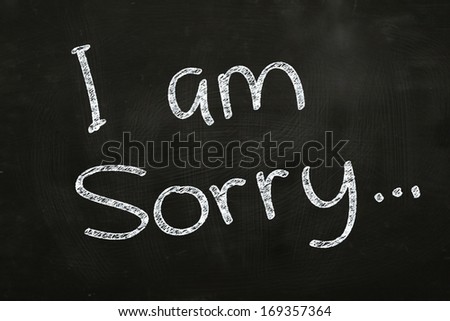 I am Sorry Writing, written with Chalk on Blackboard