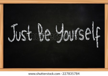 The words Just Be Yourself written with chalk on blackboard