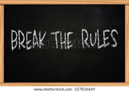 The words Break The Rules written with chalk on blackboard