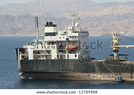 cargo ship and pilot boat in gulf of aqaba