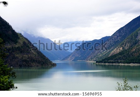 mountain lake with overcast sky. room for text