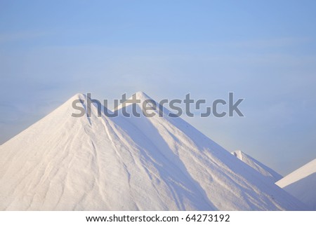 Salt mountains with blue sky at Bonaire, Caribbean