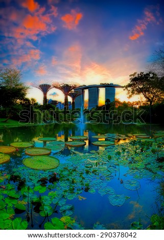 SINGAPORE-JUN 07: Evening view of Water Lily pond, and Marina Bay Sands at Gardens by the Bay on Jun 07, 2015 in Singapore. Spanning 101 hectares of reclaimed land in central Singapore.