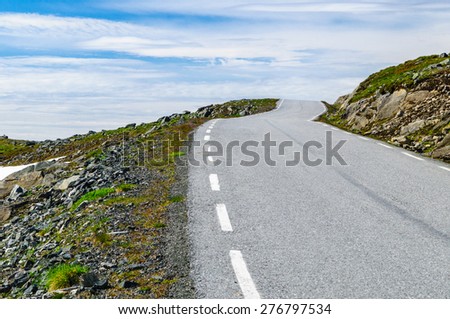 Winding desert road to heaven in Norway