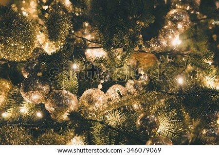 Decorated and illuminated christmas tree, vintage toning
