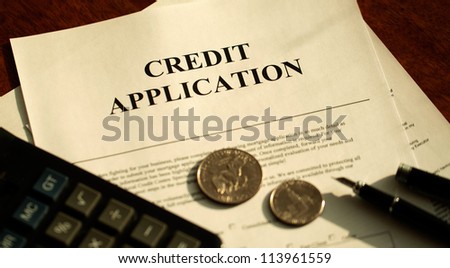Blank Credit Application Form And Pen, dollar, calculator on desktop