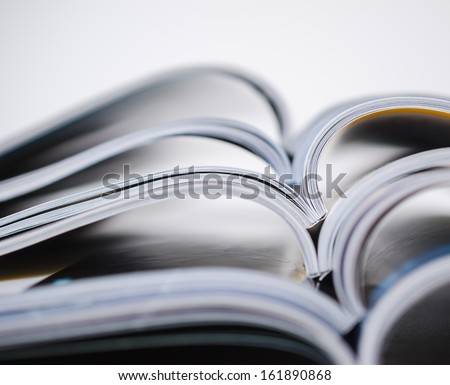 Magazines stacked in shallow focus