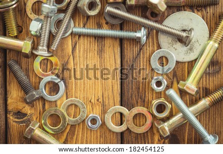 Metal washers, nuts and bolts creating a frame