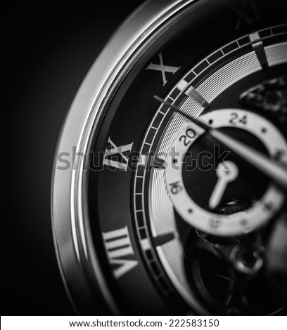 A luxury watch up close in black and white