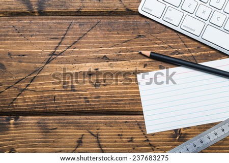 Wooden desktop with office supplies and copy space