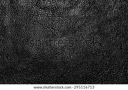 The photo shows a sample of the texture of black leather