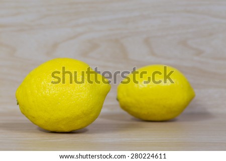 Lemon isolated on wooden background