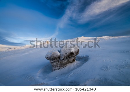 Winter landscape with snow and rock in the morning light