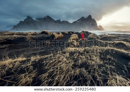 Iceland, Vestrahorn mount and black sand over the ocean. Amazing and wild outdoor landscape