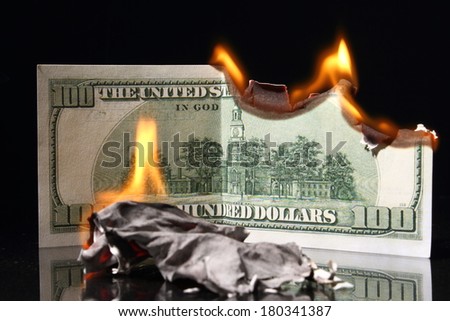 One hundred dollars in fire, burning dollar, ashes