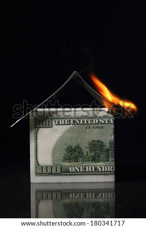 House made with One hundred dollars in fire, burning dollar