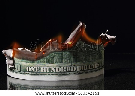 money, One hundred dollars in fire, burning dollar, ashes