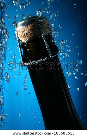 shampagne bottle neck on water with bubbles
