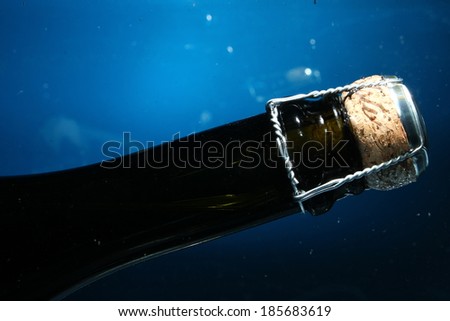 shampagne bottle neck on water with bubbles