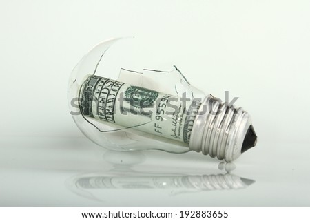 broken bulb with dollar
