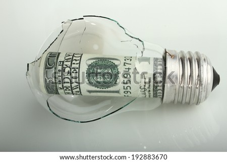 broken bulb with dollar