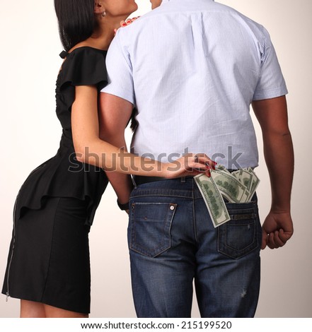 woman stealing money from man pocket
