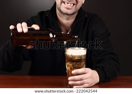 alcoholic in despair drinking beer, bad teeth, drunk man