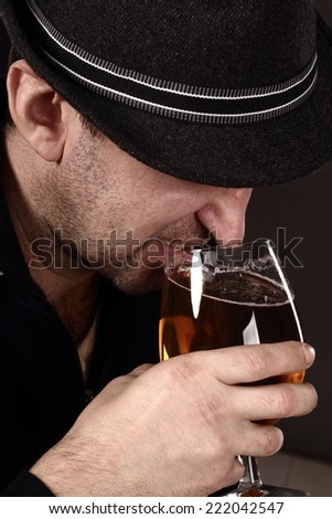 alcoholic in despair drinking beer, bad teeth, drunk man