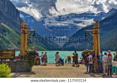 LAKE LOUISE, CANADA - AUG 06: View of the famous lake Louise from Fairmount Chateau Lake Louise Hotel on Aug 06, 2012. Lake Louise is the second most-visited destination in the Banff National Park.