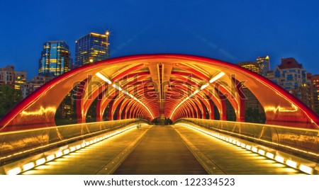 CALGARY, CANADA - JUNE 27: THe night view of Peace Bridge on June 27, 2012 in Calgary, Alberta Canada. The pedestrian bridge spans the Bow River and was designed by Santiago Calatrava.