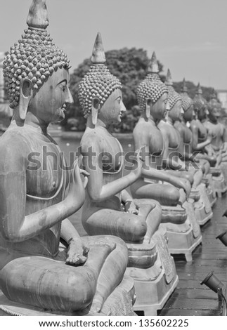 COLOMBO, SRI LANKA - MARCH 16: Famous sitting Buddha statues in the Seema Malaka Temple in Colombo on March 16, 2013. This is situated on Beira Lake and is part of the Gangaramaya Buddhist Temple.