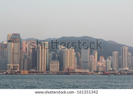 HONG KONG - OCTOBER 31: Victoria Harbor on Oct 31, 2013 in Hong Kong, China. With a population of 7 million people, Hong Kong is one of the most densely populated areas in the world