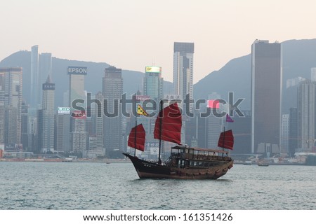 HONG KONG - OCTOBER 31: Victoria Harbor on Oct 31, 2013 in Hong Kong, China. With a population of 7 million people, Hong Kong is one of the most densely populated areas in the world