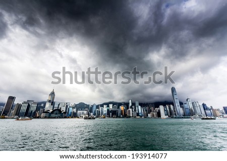 View of Victoria harbor just before a tropical cyclone During summer, typhoons regularly skirt the city, causing varying degrees of damage including injuries and deaths