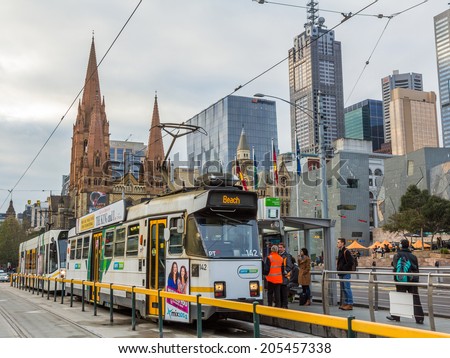 MELBOURNE, AUSTRALIA - JUNE 3, 2014: Tramway under St Paul\'s Cathedral in Melbourne, Australia. The Melbourne tramway network is a major form of public transport in Melbourne.