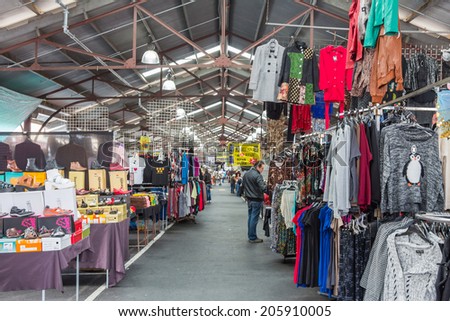 MELBOURNE, AUSTRALIA - JUNE 3, 2014: Unidentified people shop at famous Queen Victoria Market in Melbourne Australia. The largest open air market in the Southern Hemisphere.