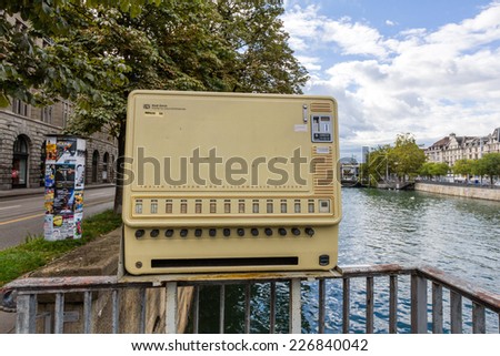 ZURICH, SWITZERLAND - SEP 21, 2014: An old type of a vending machine next to Limmat river in Zurich, Switzerland.