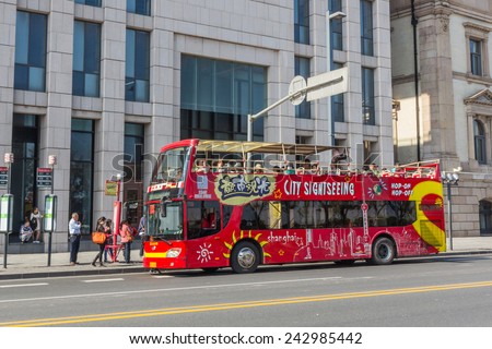 SHANGHAI, CHINA - OCT 24, 2014: Shanghai Sightseeing Open-top tour bus with audio guide, various languages available, is the great way see the Shanghai\'s major sights in short time.