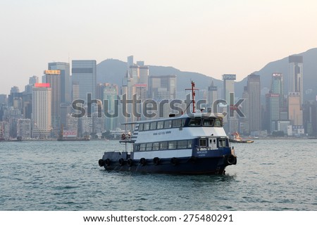 HONG KONG - APR 20, 2014: Ferry leaving Kowloon pier in Hong Kong, China. Hong Kong ferry is in operation in Victoria harbor for more than 120 years.