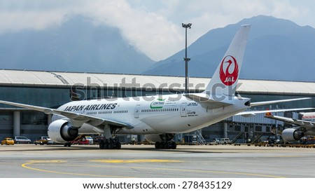 HONG KONG - APR 30, 2015: Japan Airlines flight in Hong Kong International Airport. About 90 airlines operate flights from HKIA to over 150 cities across the globe.