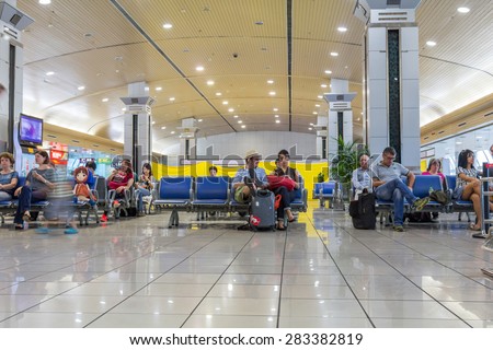 GUILIN, CHINA - MAY 03, 2015: People waiting at the departure gate for boarding at Guilin Liangjiang International Airport. In 2014 it was the 33rd busiest airport in China with 5875327 people.