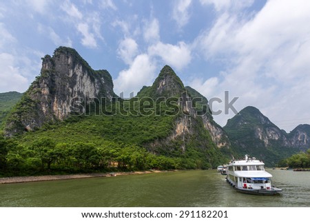 Cruise ship travels the magnificent scenic route along the Li river from Guilin to Yangshou.