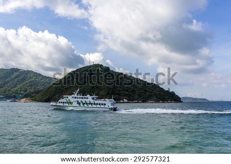 HONG KONG - JUNE 14, 2015: Ferry services between Hong Kong and Lamma Island. It is the third largest island in Hong Kong. Administratively, it is part of the Islands District.