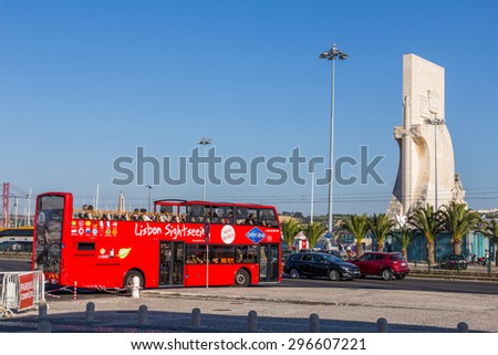 LISBON, PORTUGAL - MAY 26, 2015: Lisbon sightseeing bus stopped next to Monument to the Discoveries . This is one of the best ways to enjoy most of Lisbon in a short time.